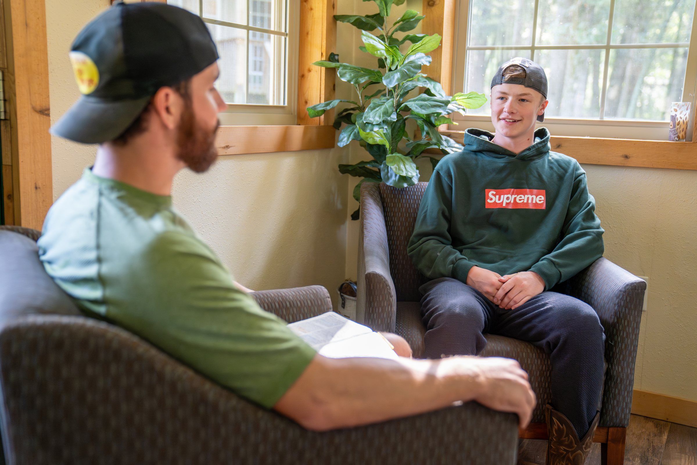 A Future Men mentor listening to a student during a one-on-one conversation